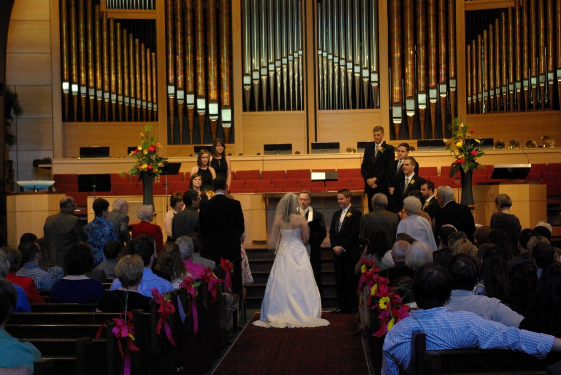 Wedding ceremony in the Lake Grove Presbyterian sanctuary, the pipe organ rising behind the chancel