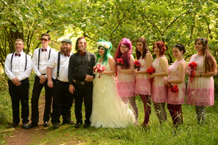 Colorful alternative wedding party with green-haired bride in Portland forest