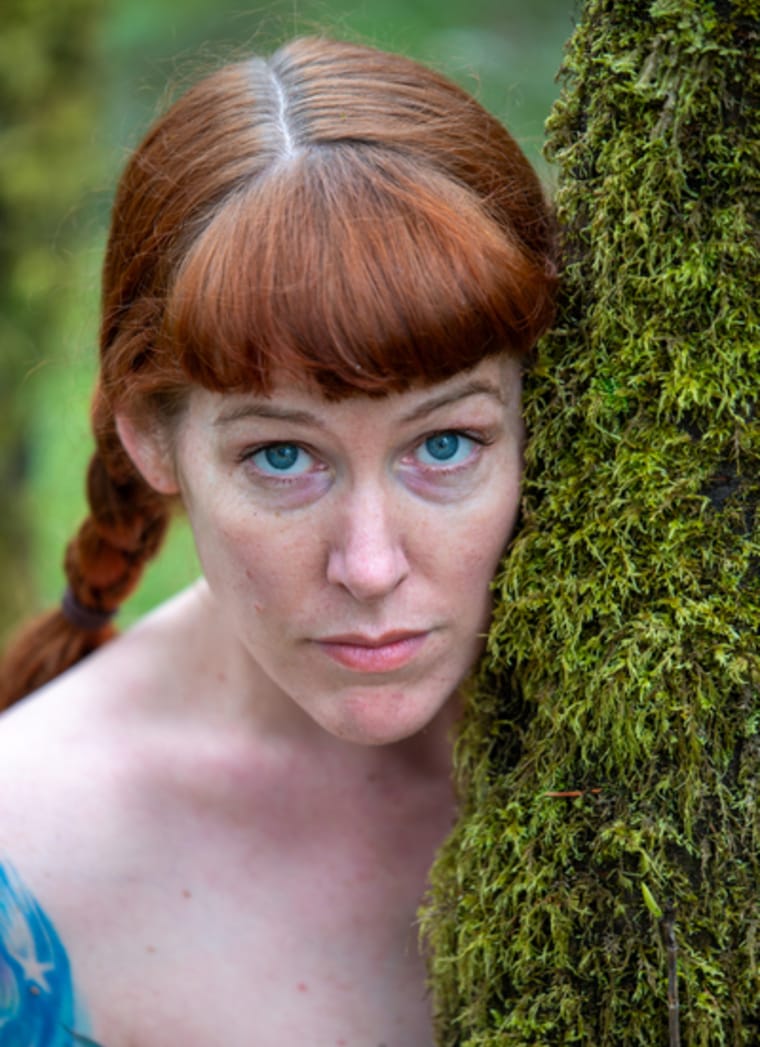 Intense portrait of woman with red hair against mossy tree - Portland fine art photography