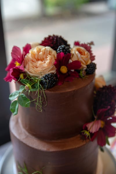 Chocolate wedding cake decorated with roses and blackberries - Portland wedding detail