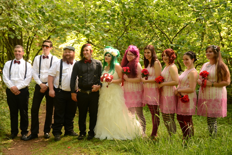 Older wedding guests walking and smiling at outdoor reception